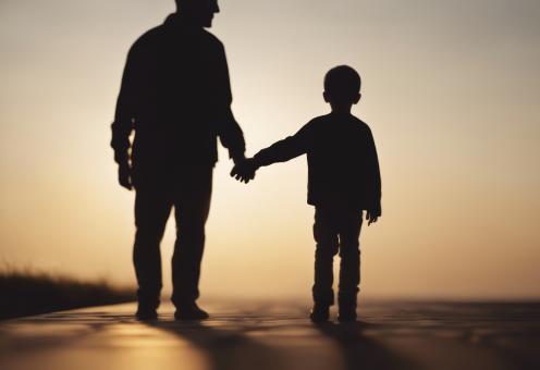 Free Stock Photo of Silhouette of Father Holding His Son's Hand