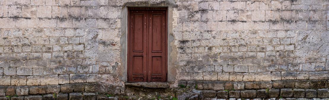 Free Stock Photo of  old door in a stone wall