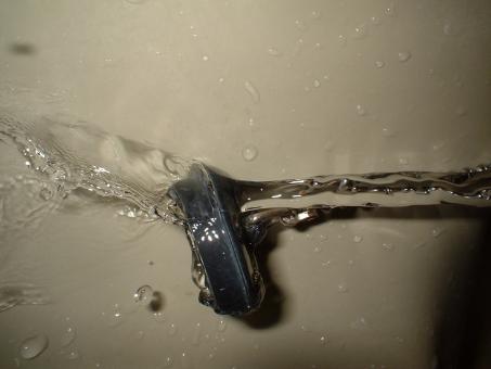 Free Stock Photo of Plug hit by water