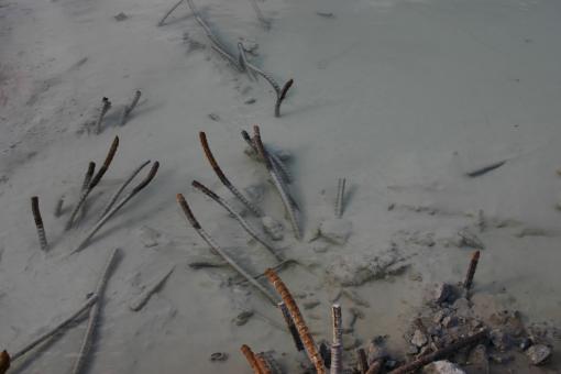Free Stock Photo of Rusted metal bars in water