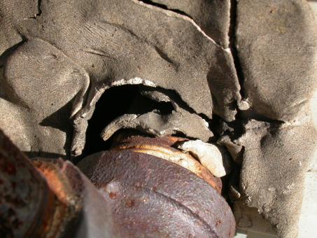 Free Stock Photo of Rusted pipe in broken wall