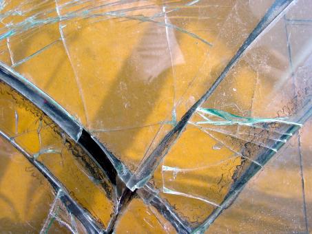 Free Stock Photo of Shattered glass over yellow background