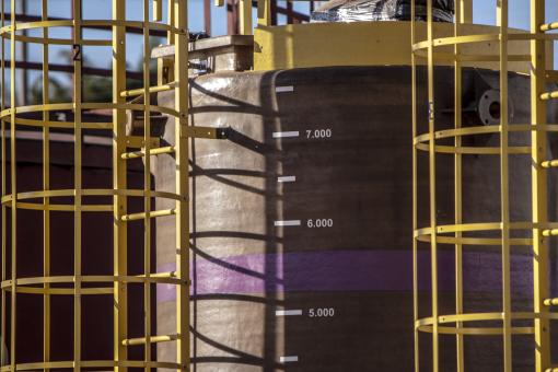 Free Stock Photo of Yellow Ladders on Industrial Tank