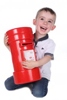 Free Stock Photo of Happy Boy with Red Postbox
