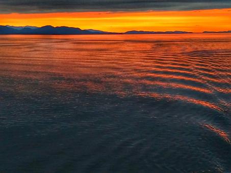 Free Stock Photo of Sunset Over Ripples at Sea