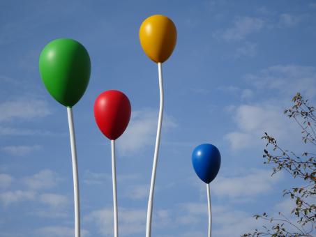 Free Stock Photo of Colored metal balloons in a public garden