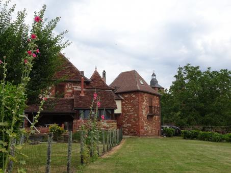 Free Stock Photo of Old red sandstone house in a green landscape