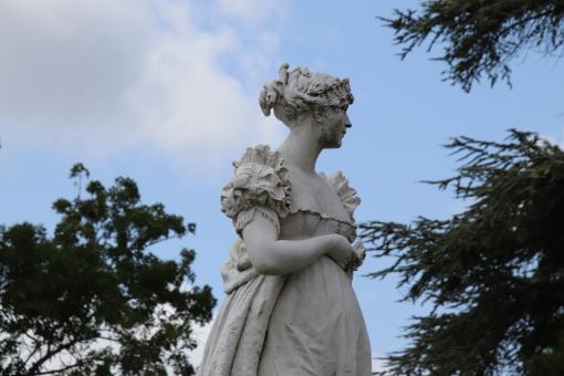 Free Stock Photo of White woman statue in a park