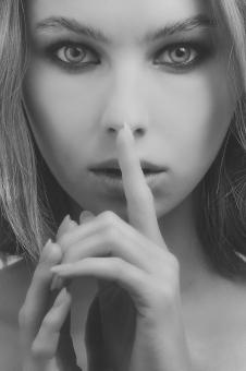 Free Stock Photo of Portrait of a woman - Finger in front of Mouth