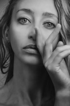 Free Stock Photo of Face and Fingers - Woman Portrait in Black and White