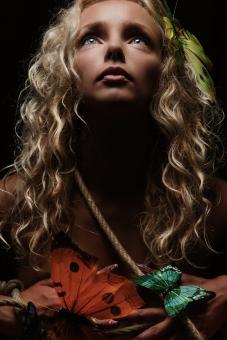 Free Stock Photo of Blond Girl Holding Butterflies