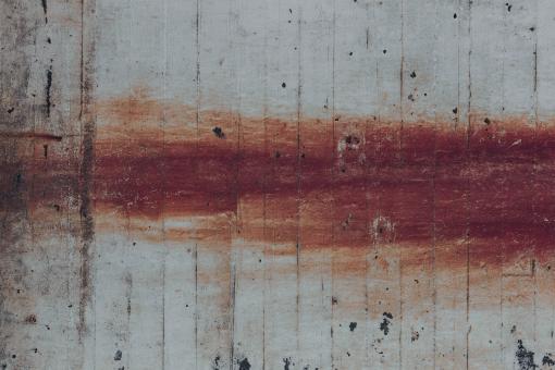 Free Stock Photo of Rusty Streaks on Worn Concrete