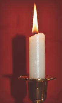 Free Stock Photo of Candle on a red background