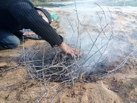 Free Stock Photo of Man Making Fire