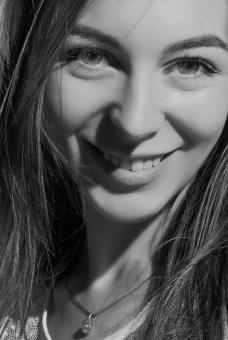 Free Stock Photo of Young Girl Smiling - Black and White Portrait