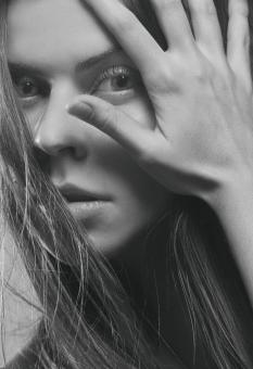 Free Stock Photo of Girl with Hand in Front of Face - Monochrome