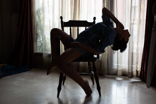 Free Stock Photo of Sexy elegant woman a blue shirt is posing on chair