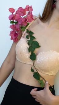 Free Stock Photo of A Woman Holding A Flower in Her Hands