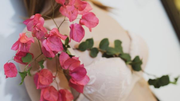 Free Stock Photo of Woman Holding Flowers In Her Hands
