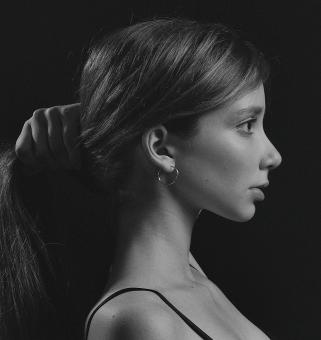 Free Stock Photo of Brunette Girl Portrait - Holding Hair