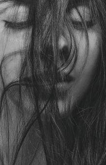 Free Stock Photo of Brunette with Closed Eyes and Hair over Face