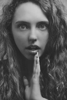 Free Stock Photo of Young Model with Curly Hair - Monochrome