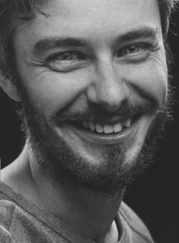 Free Stock Photo of Smiling Man with Beard - Monochrome Portrait