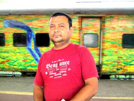 Free Stock Photo of Male Portrait in Front of Train