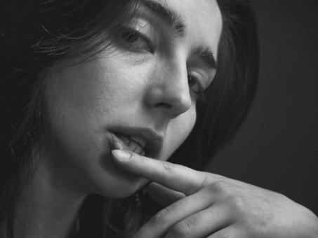 Free Stock Photo of Female with Finger on Lips - Monochrome
