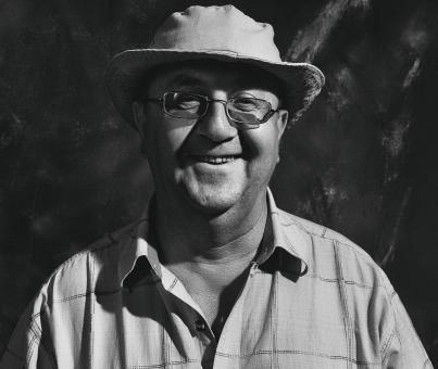 Free Stock Photo of Smiling Adult Man with Hat and Glasses - Black and White