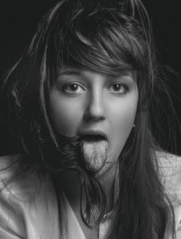 Free Stock Photo of Emotional Girl - Sticking Tongue Out - Monochrome