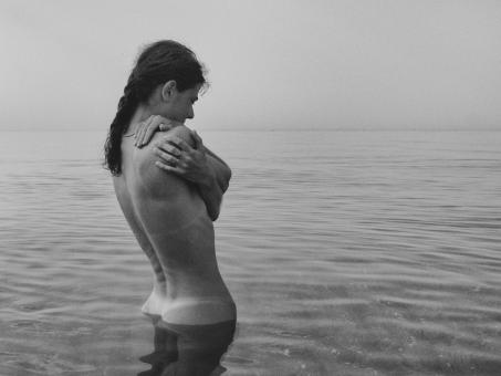Free Stock Photo of Naked Woman in the Sea - Monochrome