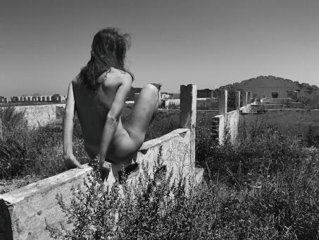 Free Stock Photo of Girl Posing on Wall - Monochrome