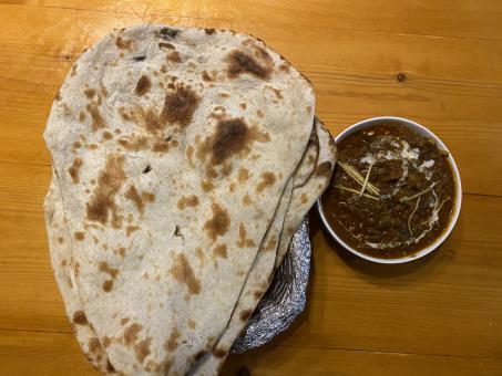 Free Stock Photo of Indian Style food which has Naan rotti and Kurma