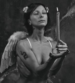 Free Stock Photo of Girl with Wings Holding a Candle - Monochrome