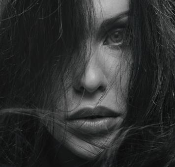 Free Stock Photo of Sensual Woman with Dark Hair - Monochrome Portrait