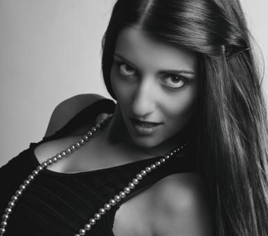 Free Stock Photo of Brunette with Pearl Necklace - Monochrome