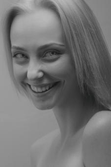 Free Stock Photo of Smiling Blond Woman - Monochrome Portrait
