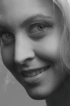 Free Stock Photo of Smiling Blond Girl Portrait - Monochrome
