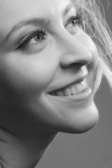 Free Stock Photo of Smiling Young Girl Profile - Monochrome