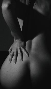 Free Stock Photo of Nude Woman with Hand on Back - Monochrome