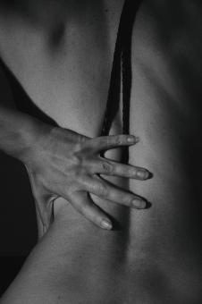 Free Stock Photo of Artistic Portrait of Nude Woman With Hand on Back