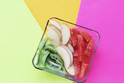 Free Stock Photo of Bowl of fruits on colorful background 