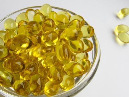 Free Stock Photo of Yellow capsules with vitamin D