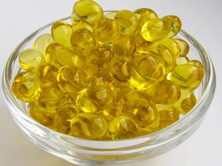 Free Stock Photo of Yellow capsules with vitamin D