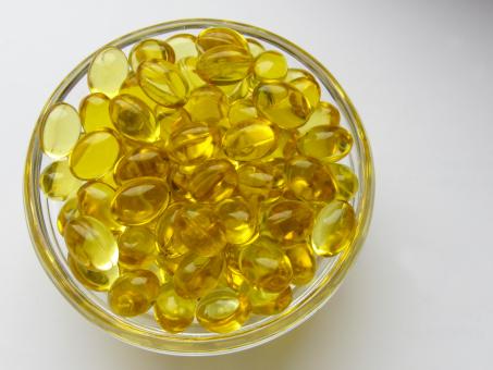 Free Stock Photo of Yellow capsules with vitamin D