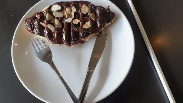 Free Stock Photo of A white plate topped with a piece of chocholate cake and a fork