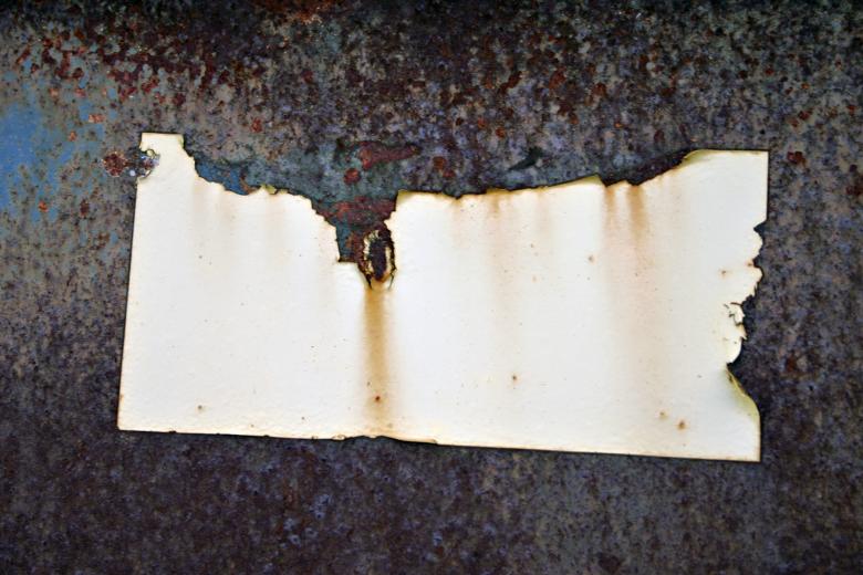 Free stock image of Rusted metal plate with sticker created by Bjorgvin
