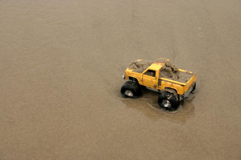 Free stock image of Toy car in sand created by Bjorgvin