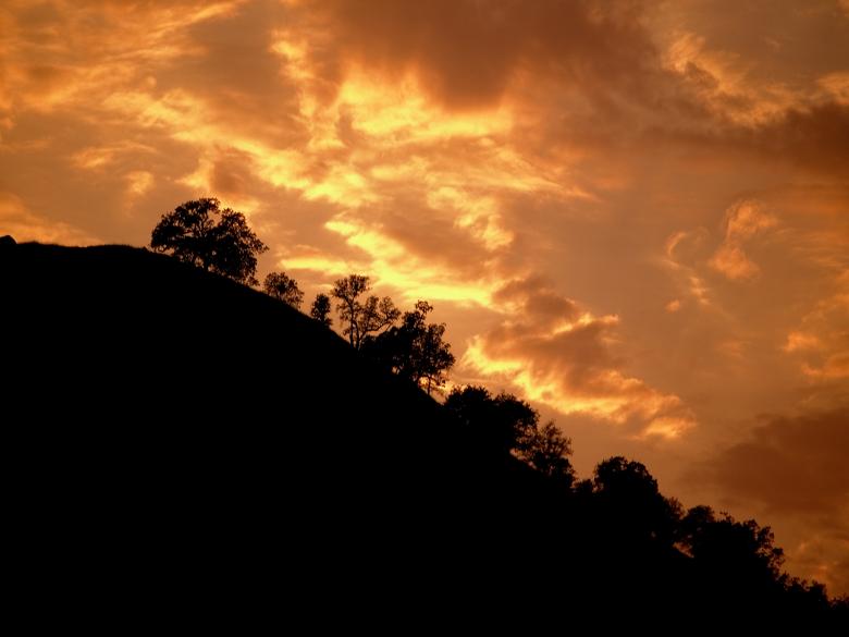 Free stock image of Sunset Behind Mountain created by j. l. johnson